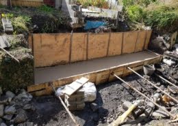 Neat concrete foundations to stabilize new gabions